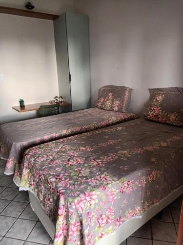 Ένα ή περισσότερα κρεβάτια σε δωμάτιο στο Quartos em Casa Familiar, Aeroclube, Praia do Bessa