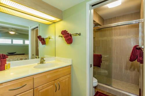 a bathroom with a sink and a shower at Sugar Beach 334 - MCH in Kihei