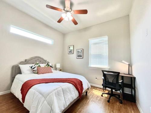 a bedroom with a bed and a ceiling fan at NEW! Luxury Apt, 5 min from Mall, Airport, & Dine! in McAllen
