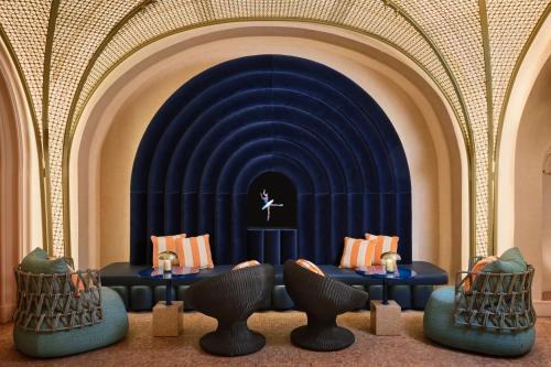 a room with a blue stage with tables and chairs at W Budapest in Budapest