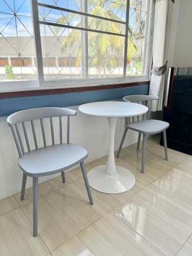 two chairs and a table and a table and a chair at Diamond de pai in Pai