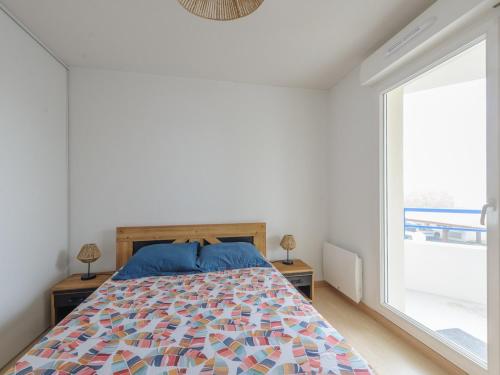 a bedroom with a bed and a large window at Appartement Calme avec Grande Terrasse, Aytré, Proche Lac, 2 Pers. - FR-1-535-49 in Aytré
