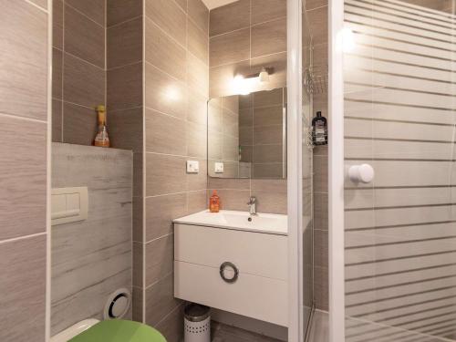 a bathroom with a sink and a mirror at Chalet Cauterets, 3 pièces, 8 personnes - FR-1-401-269 in Cauterets