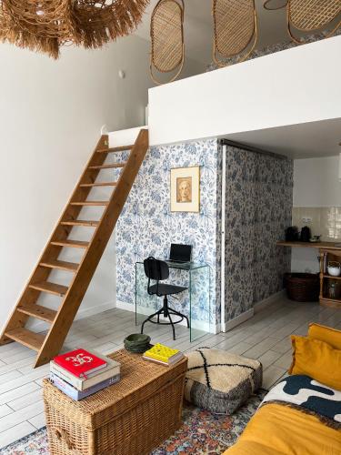 a room with a loft bed and a desk at Tiny house 15min away from Opera Garnier in Argenteuil