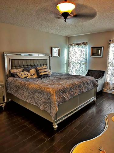 a bedroom with a large bed in a room at Ameriwest Missionary Guest House Edificio #2 in Boca Chica