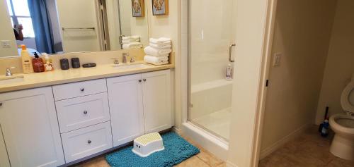 a bathroom with a shower and a sink and a toilet at OC lrvine eastwood family Lux 4beds &3 bath villa in Irvine