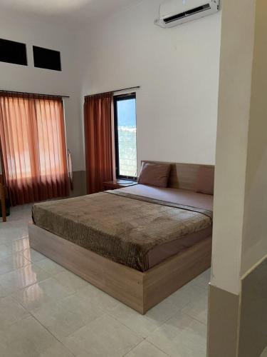 Ένα ή περισσότερα κρεβάτια σε δωμάτιο στο Sayang Bungalows