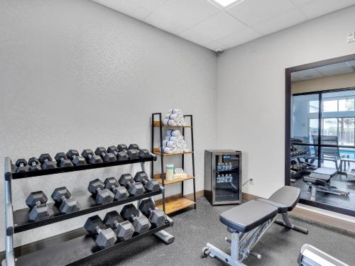 a gym with a row of chairs in a room at Country Inn & Suites by Radisson Rehoboth Beach - Dewey in Rehoboth Beach