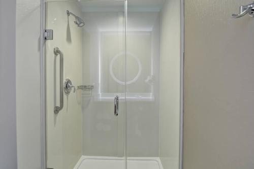 a shower with a glass door in a bathroom at SpringHill Suites Cincinnati Airport South in Florence