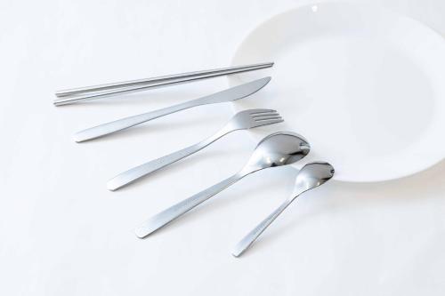 a set of silver cutlery on a white background at Nanki Shirahama Angel in Shirahama