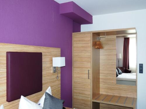 Säng eller sängar i ett rum på Hotel Prinz Heinrich