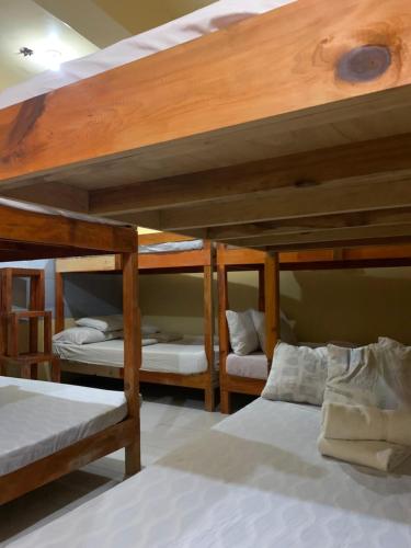 two bunk beds in a room with twoperate at Querencia Inn in Banaue