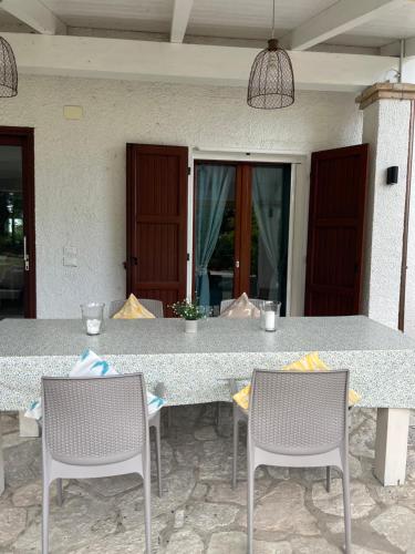 a table with two chairs and a table and a table and chairsktop at Casa Sant Angelo in Pesaro