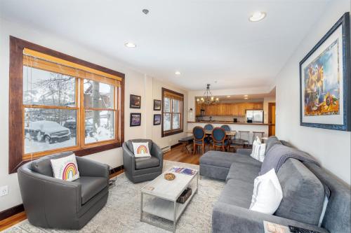 a living room with a couch and a table at One-Bedroom Apartment in Telluride