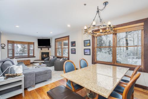 a living room with a table and a couch at One-Bedroom Apartment in Telluride