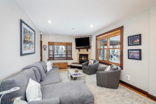 a living room with a couch and a fireplace at One-Bedroom Apartment in Telluride