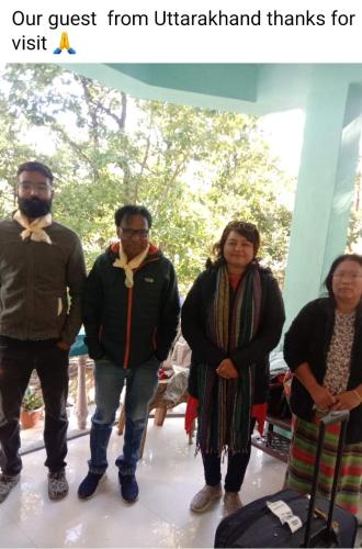 a group of people standing next to each other at Anna homestay in Dirang Dzong
