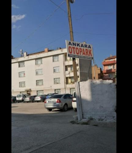 a sign for an antarctica airport in a parking lot at Hotel Ney in Konya