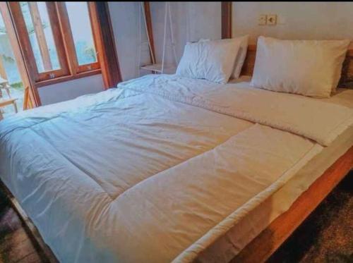Postel nebo postele na pokoji v ubytování Mayeka Transit Hostel Bandara Internasional Lombok