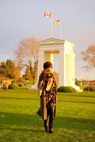 a woman standing in a field in front of a monument at Scorpion Hiuse Langley -ROOM A in Langley