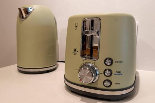 a toaster sitting on top of a counter at Stay on Northbourne Ave in Canberra