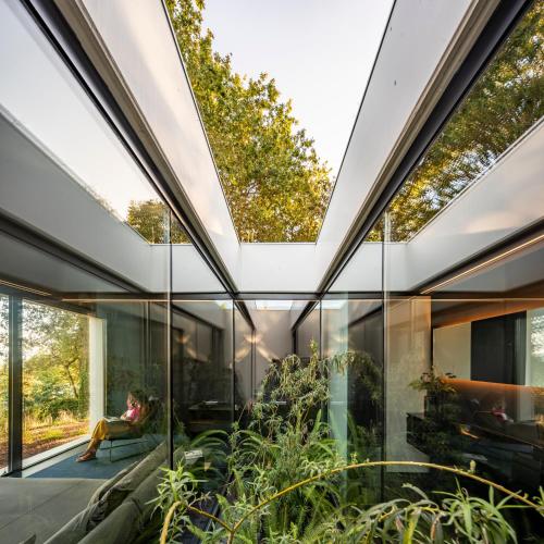 an interior view of a glass house with plants at Hotel Pepe Vieira in Raxo