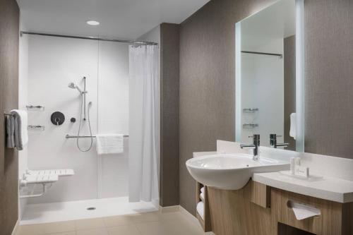 a bathroom with a sink and a shower at SpringHill Suites by Marriott Philadelphia West Chester/Exton in Exton