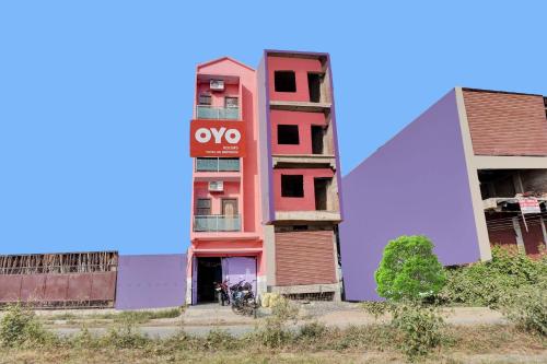 a building with a sign on the side of it at OYO Flagship B K Brothers in Patna