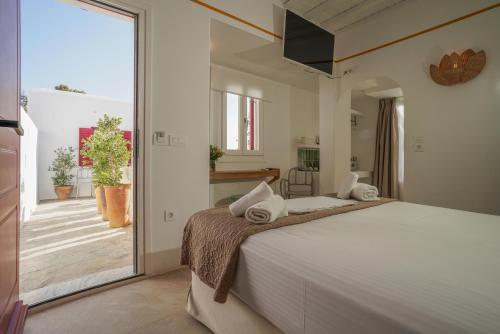 Postel nebo postele na pokoji v ubytování 23 Hotel Mykonos