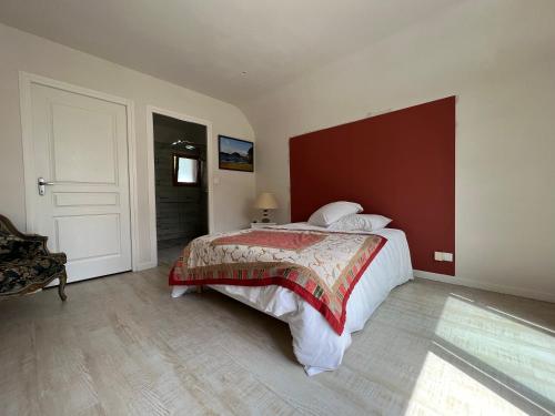 מיטה או מיטות בחדר ב-Le GRANNEC