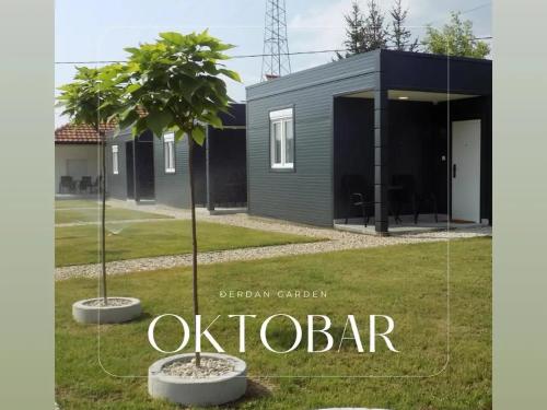 a modern house with two trees in a yard at Đerdan Garden apartments in Kraljevo