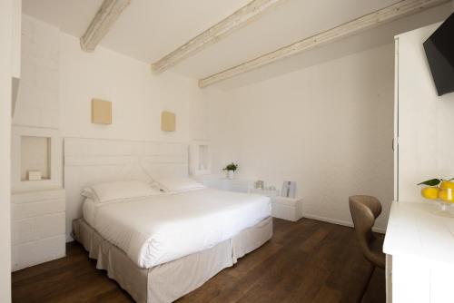 Katil atau katil-katil dalam bilik di Masseria Bandino & Spa