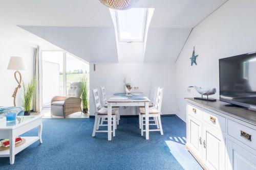 TV a/nebo společenská místnost v ubytování Haus Seeblick Wohnung 20