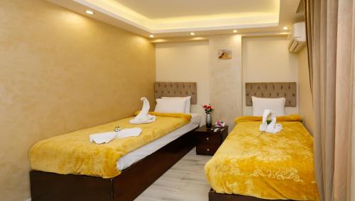 Ένα ή περισσότερα κρεβάτια σε δωμάτιο στο Venus Pyramids Inn - Top Roof Access W Free Break Fast
