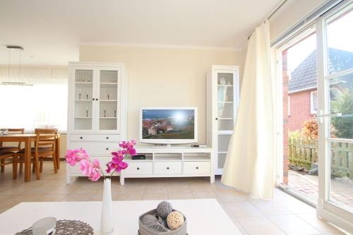 TV a/nebo společenská místnost v ubytování Haus Jenny Wohnung H 4a
