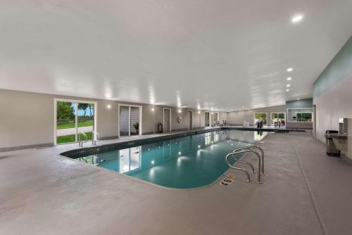 a large swimming pool in a large building at Wyndham Garden Galena Hotel & Day Spa in Galena