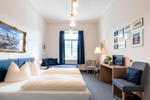 Postel nebo postele na pokoji v ubytování Hotel-Pension am Siegestor