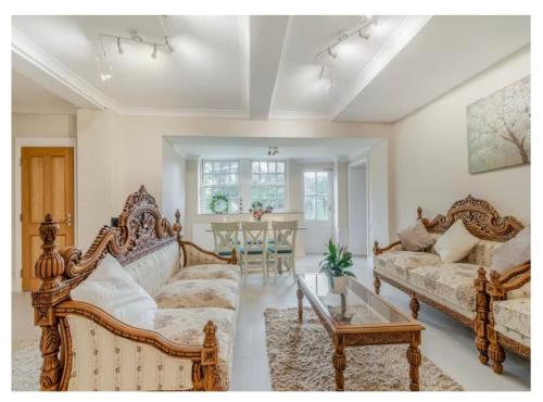a living room with a couch and a table at The Annexe at Moulton Grange in Northampton