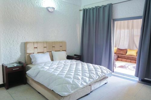 Postel nebo postele na pokoji v ubytování Hotel Warda