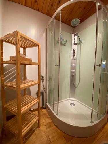 a bathroom with a shower and a glass showeroser at Chalet 't Musje in Durbuy