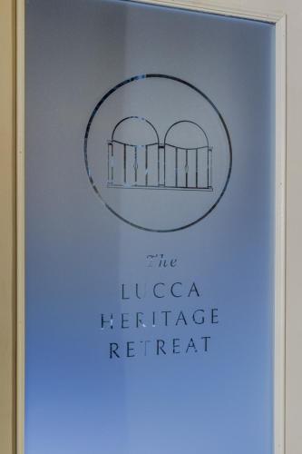 a sign for the lisca heritage retreat at Lucca Heritage Retreat in Lucca