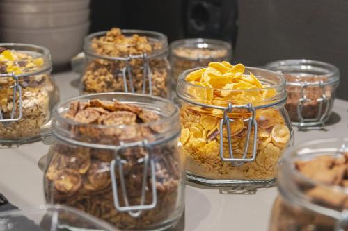 a group of jars filled with different types of food at Hotel Garni Ischia in Malcesine