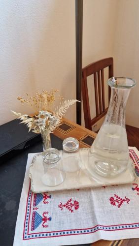 a glass vase sitting on top of a table at Weisses Kreuz - Crusch Alva in Samedan