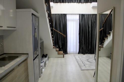 Kuchyň nebo kuchyňský kout v ubytování Royal Stay