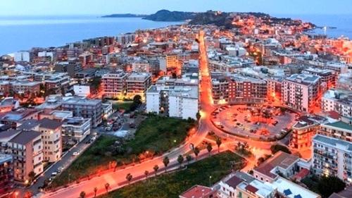 an aerial view of a city at night at Casa Vacanza NINA in Milazzo