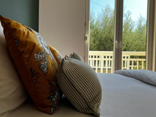 Ένα ή περισσότερα κρεβάτια σε δωμάτιο στο Kavajin Rooms