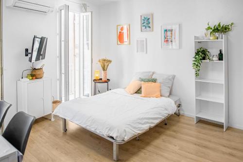 Ένα ή περισσότερα κρεβάτια σε δωμάτιο στο Le Chat Orange