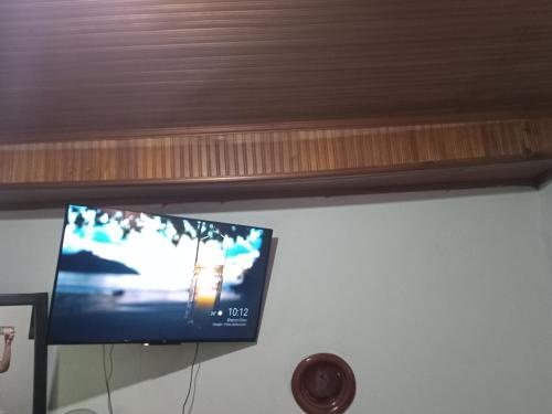 a flat screen tv hanging on a wall at Comoda habitacion in Valledupar
