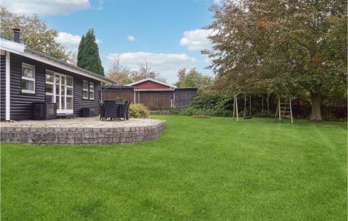 a yard with a house and a playground at Stunning Home In Græsted With Wifi in Græsted