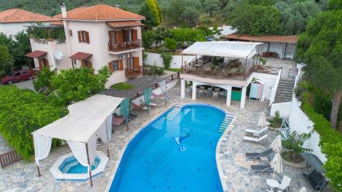 an aerial view of a villa with a swimming pool at Seralis Pelion in Afissos